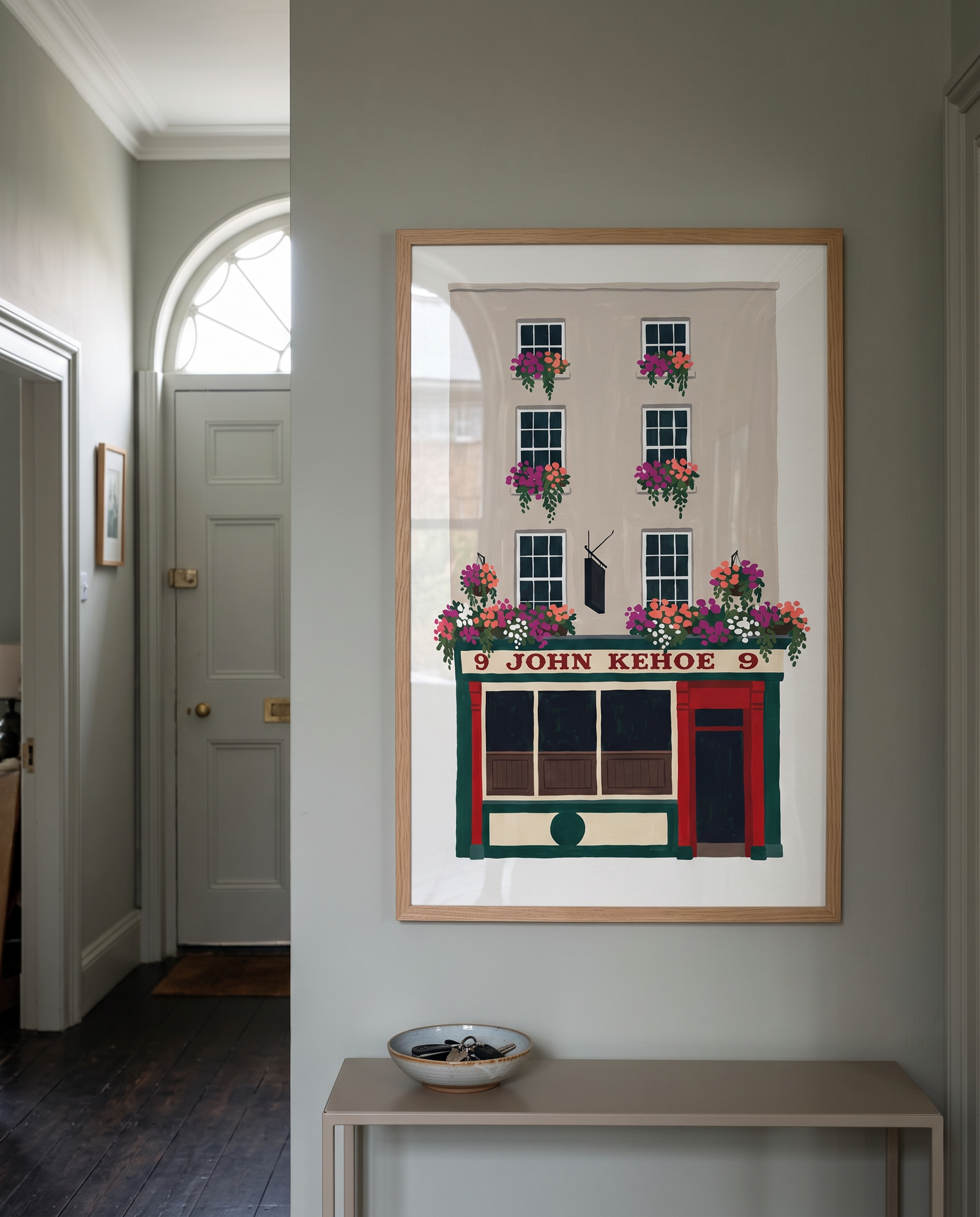 The John Kehoe print framed in oak, hanging in a Georgian Dublin hallway