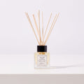 New Beginnings luxury reed diffuser by Flourish Emporium, made in Midleton, Co. Cork, on a white table